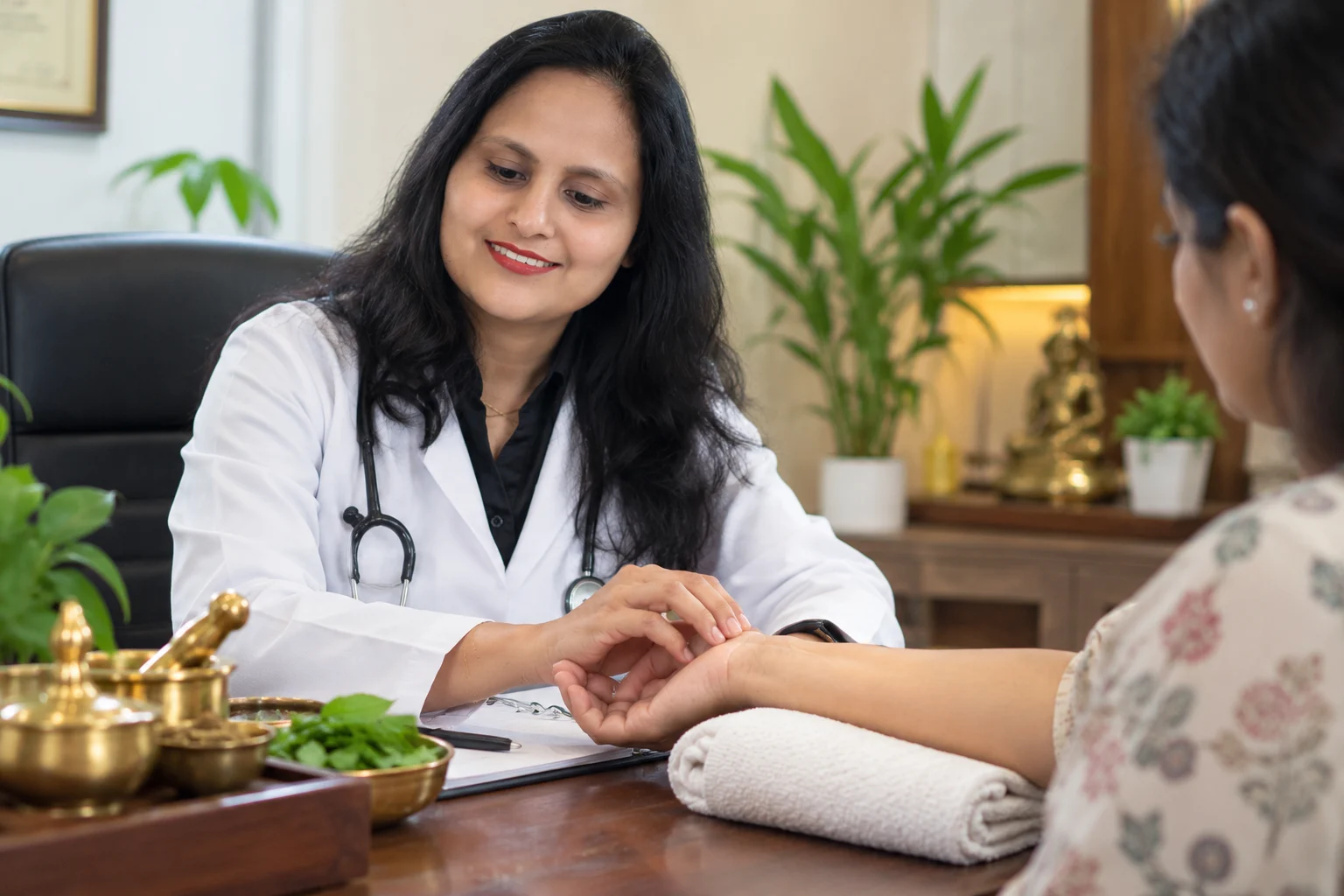 Ayurvedic physician reading the pulse during Nadi Pariksha